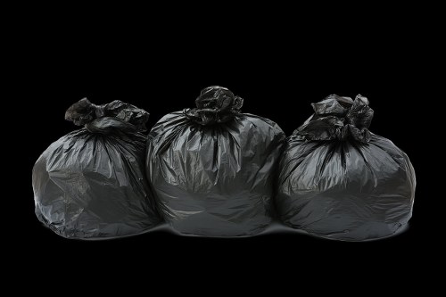 Team members sorting recyclable materials for business waste